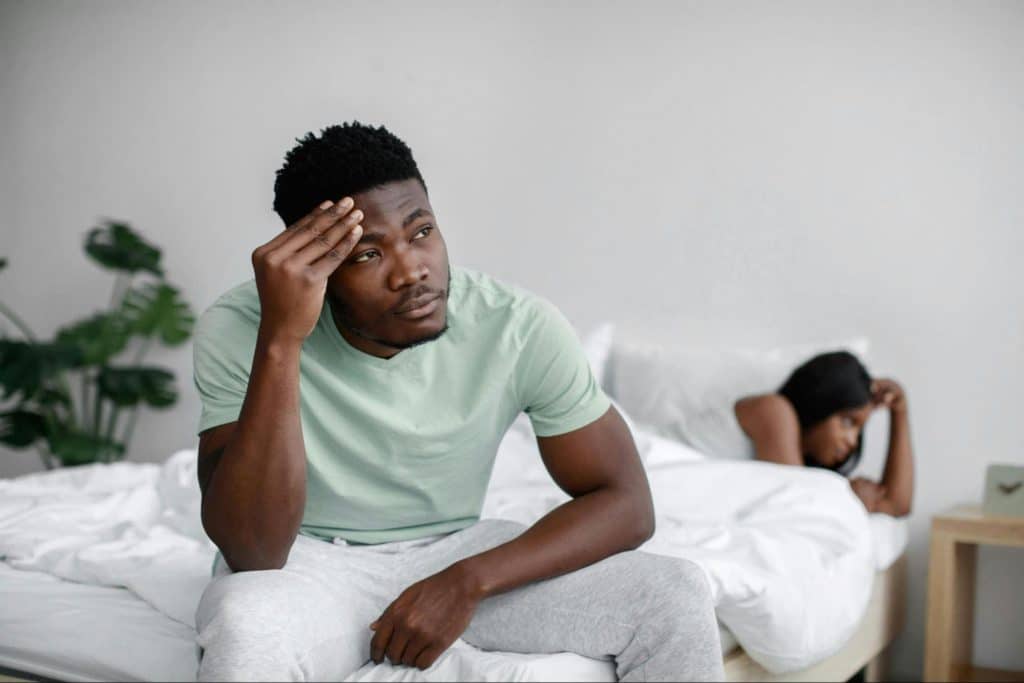 A man massaging his head