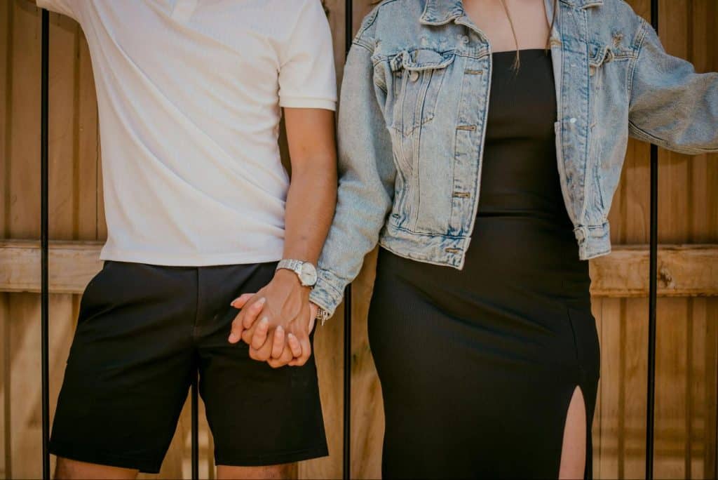 A man and woman holding hands