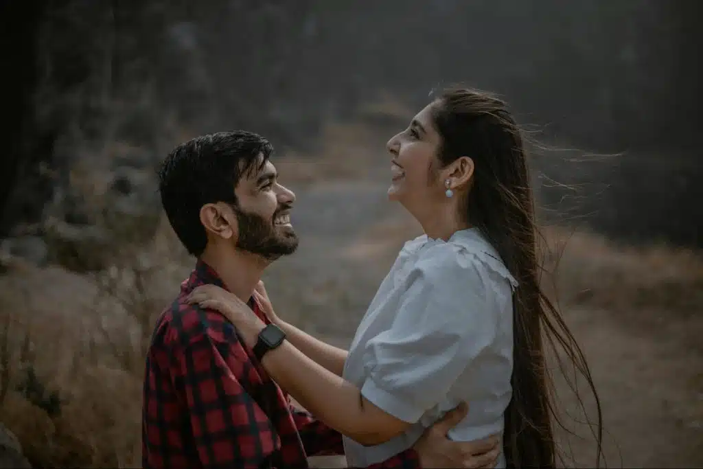 A man holding a woman