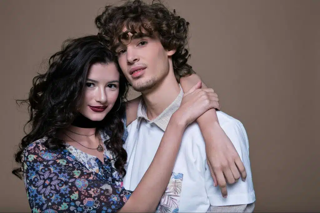 A woman hugging a man