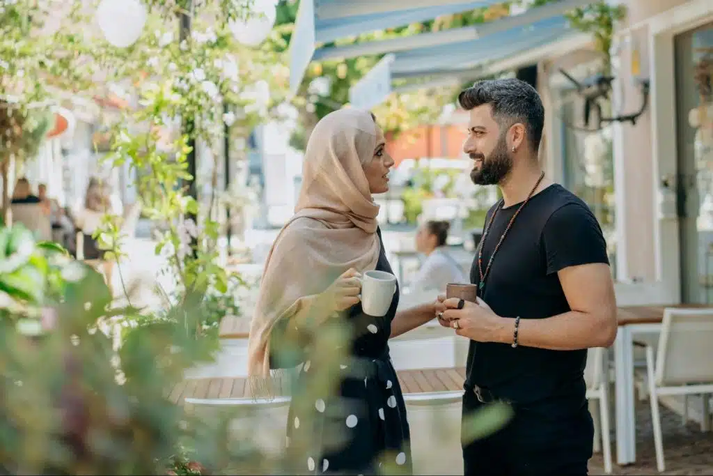 A man and woman having coffee together
