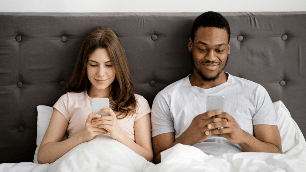 A couple busy with their phones