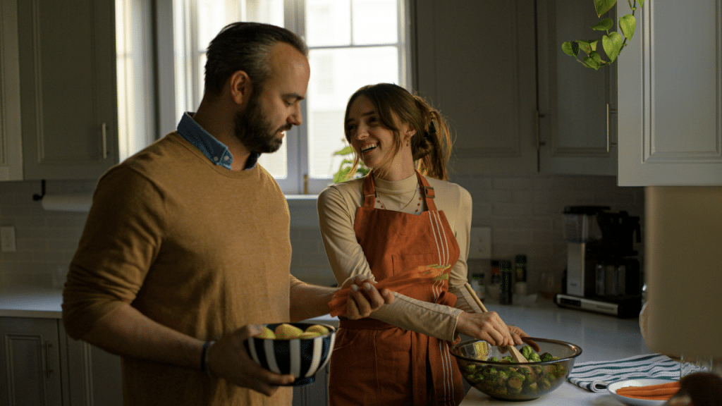 A couple preparing food in the kitchen