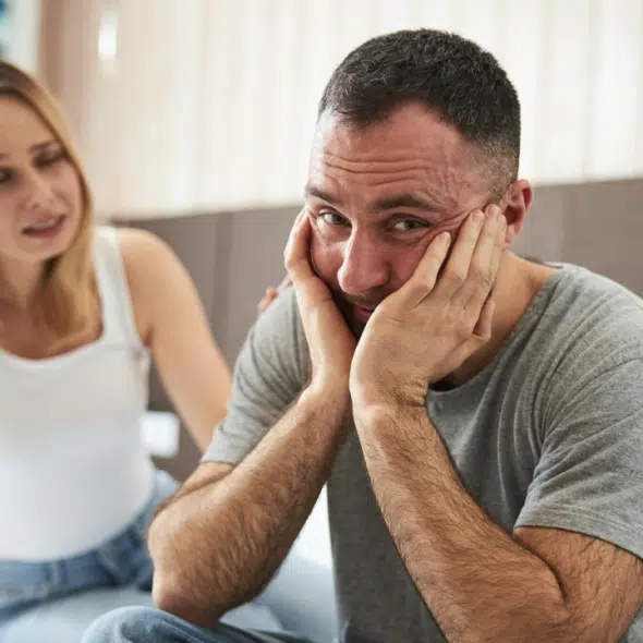 A man looking unhappy in his marriage