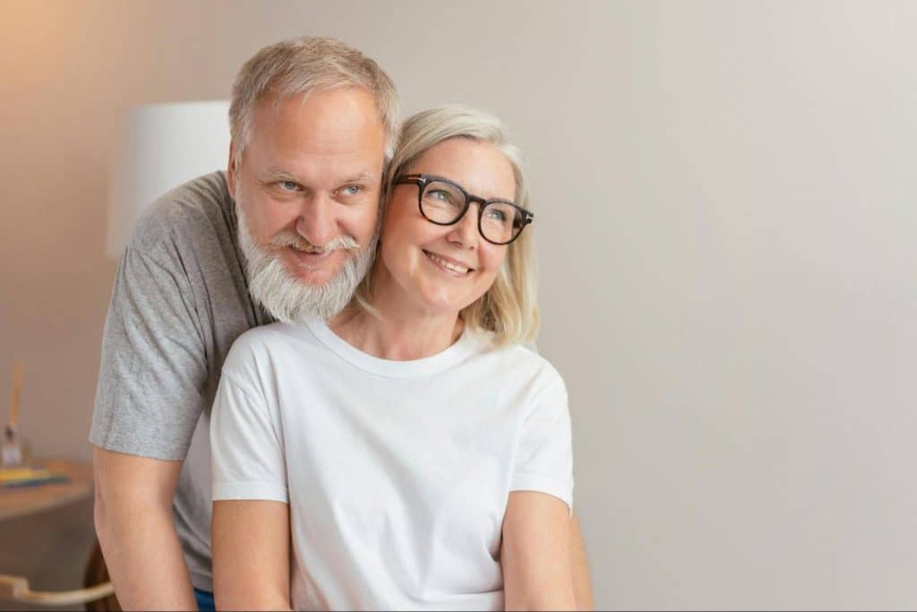 A man and woman smiling