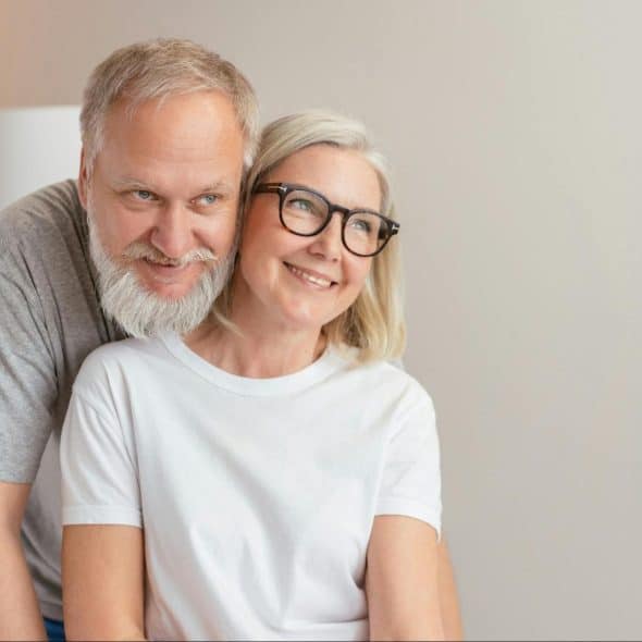 A man and woman smiling