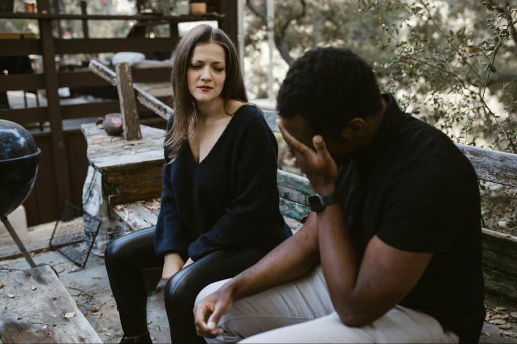 A woman looking at the man
