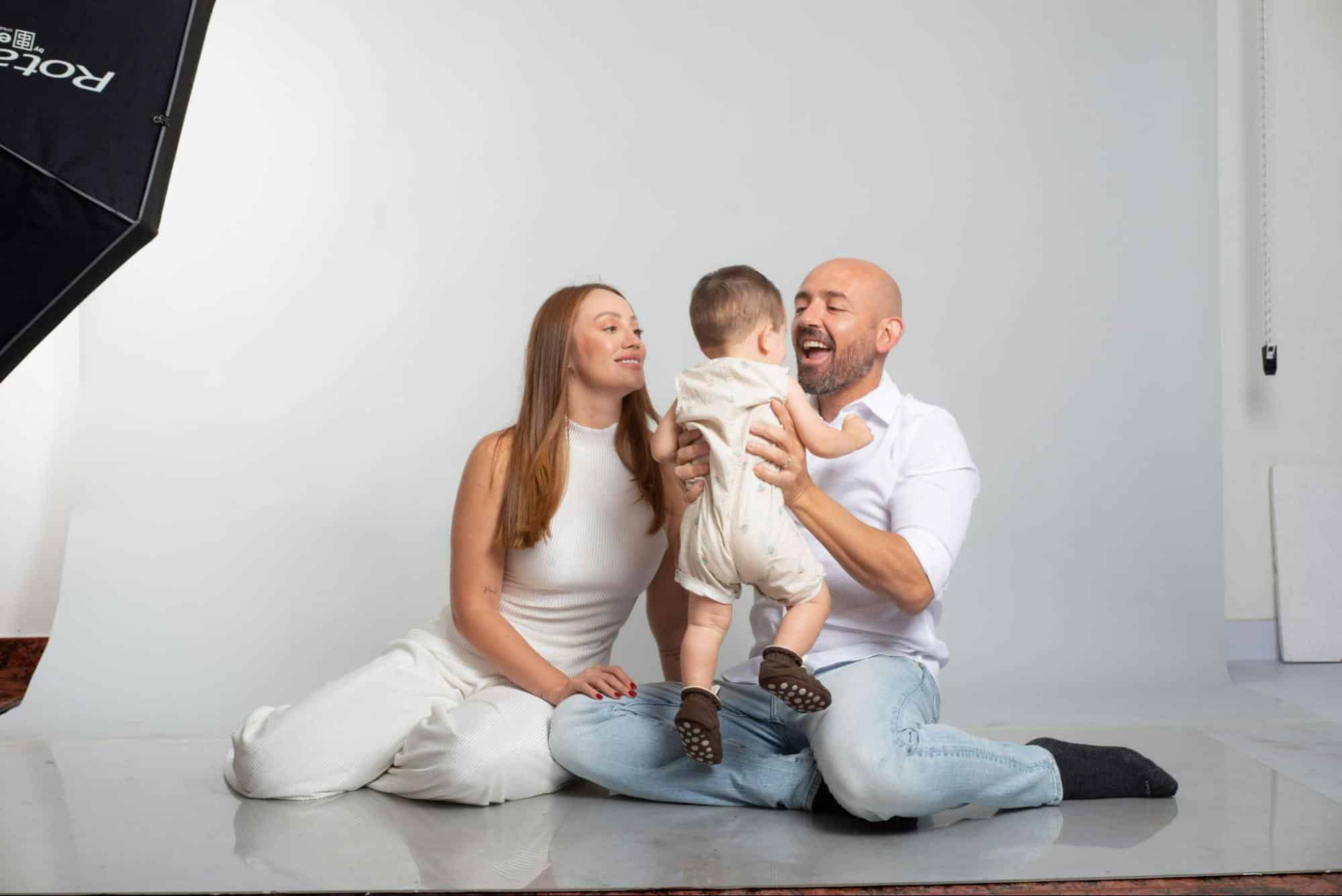 Married couple having a pictorial with their son.