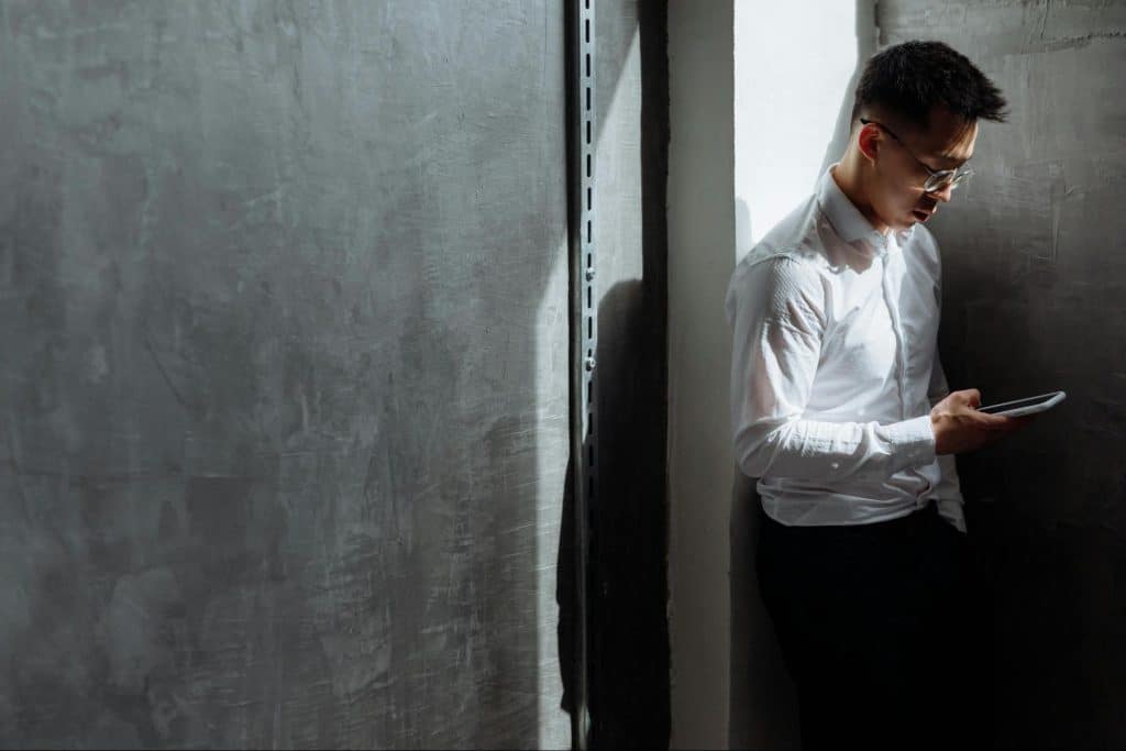 A man texting a woman