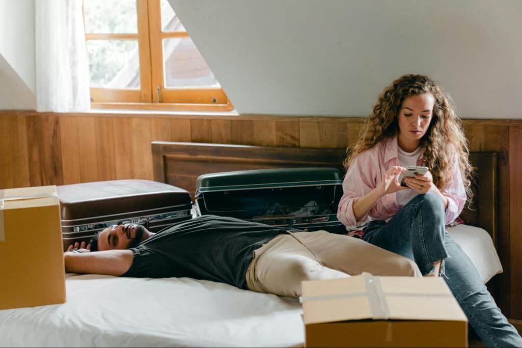A woman checking a man’s phone