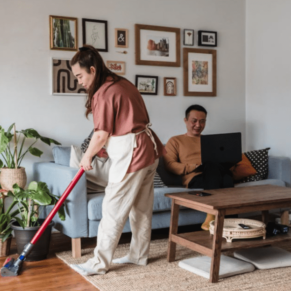 A couple not looking at each other at home