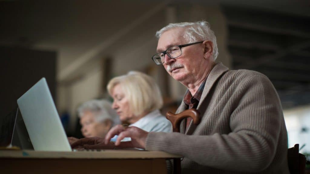An older man studying