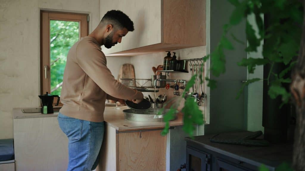 A man washing the dishes