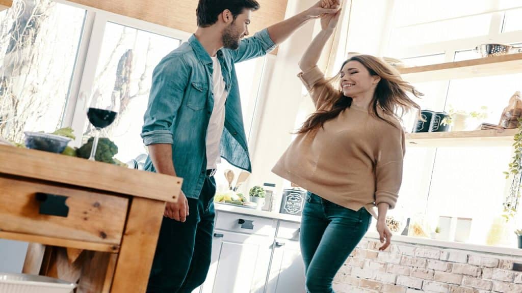 A couple dancing in the kitchen