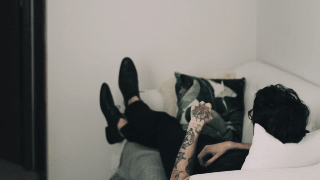 A man laying on the couch