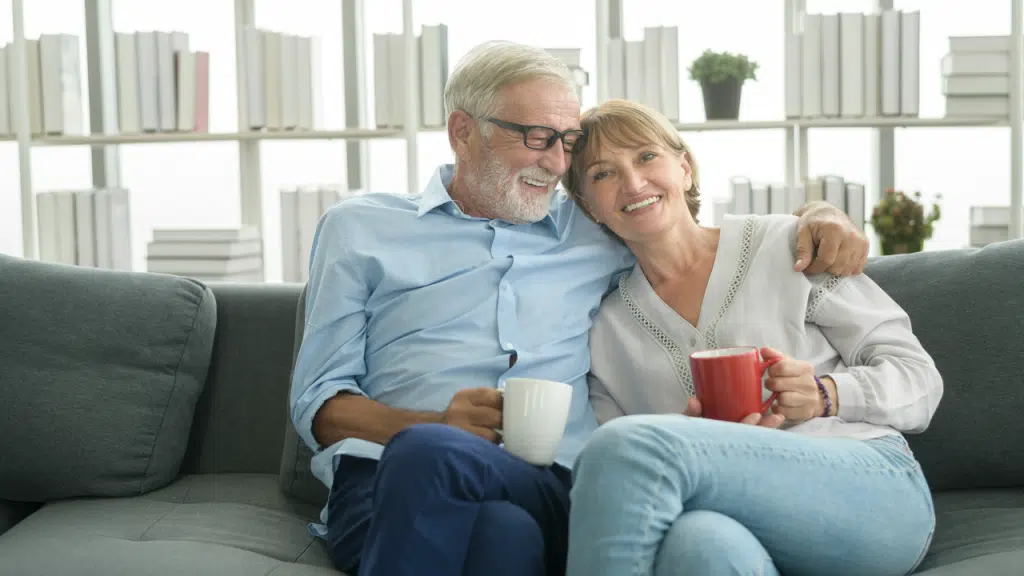 An elderly couple relaxing at home