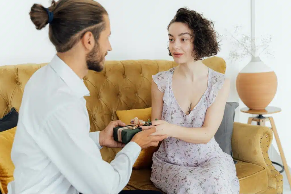 A man giving a woman a gift