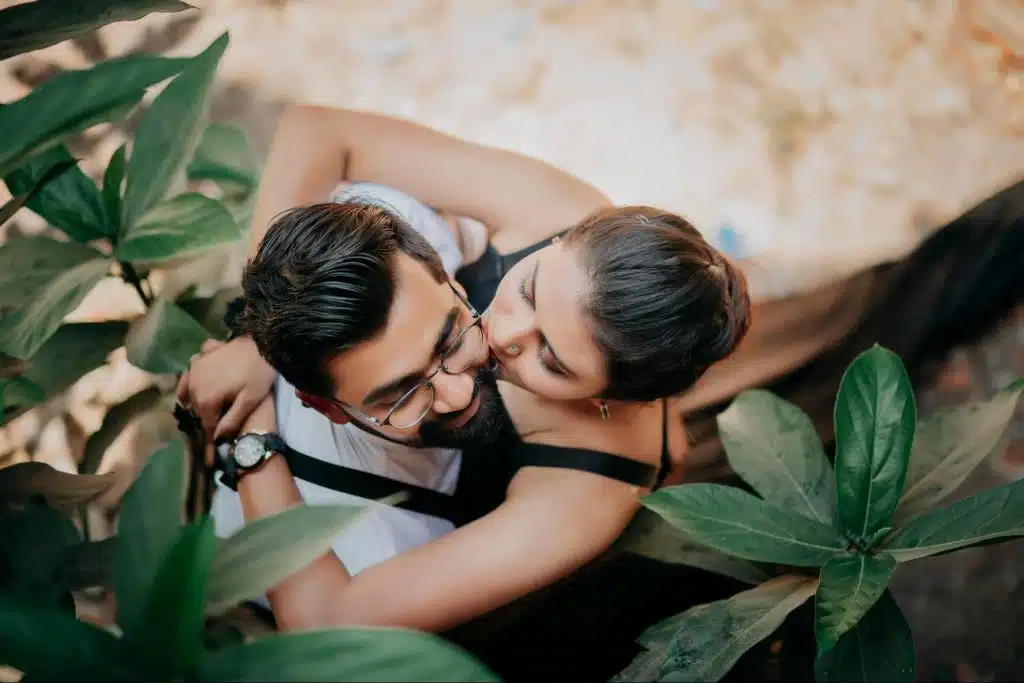 A woman kissing a man’s cheek
