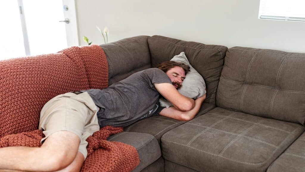 A man sleeping on the couch