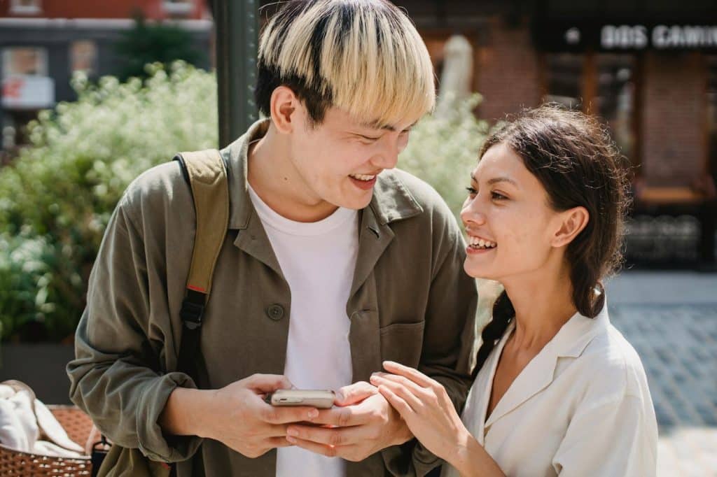 A man and woman walking outside