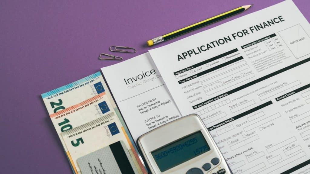 A finance application form, calculator, euro currency, and invoice are on a purple background.