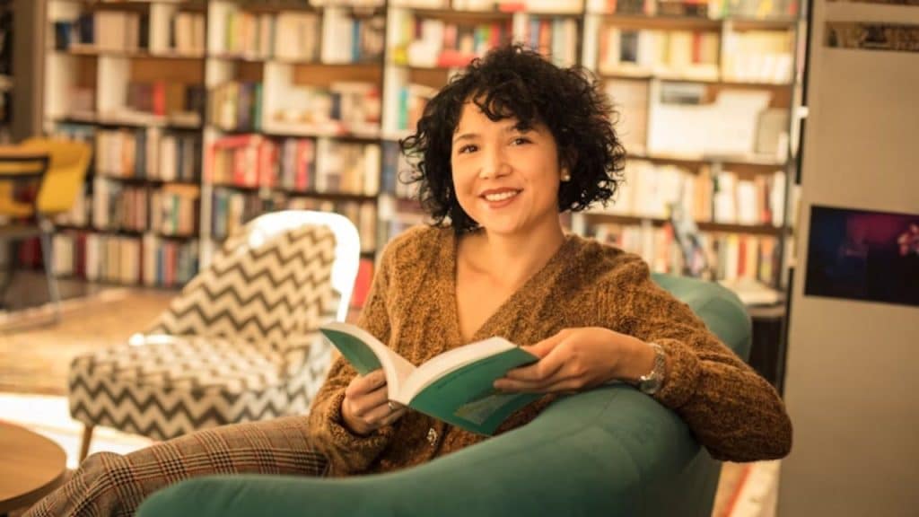A woman reading in a cozy bookstore