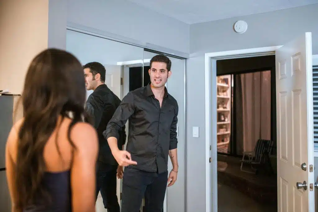 A man talking to a woman
