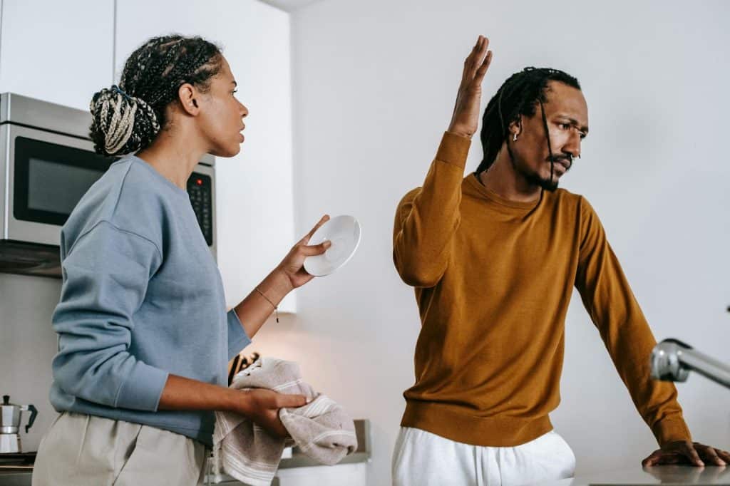 A man dismissing a woman