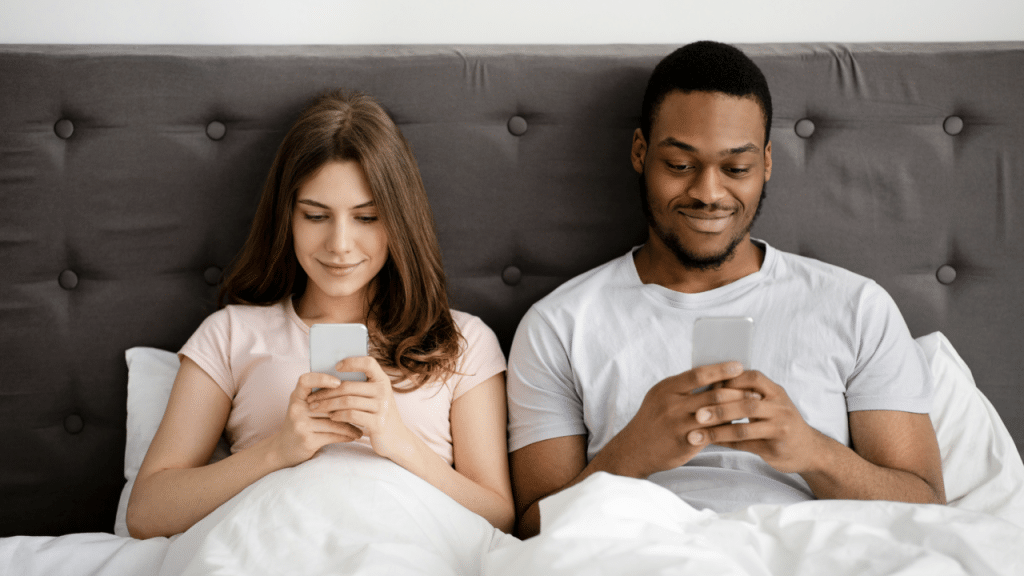 A couple busy with their phones