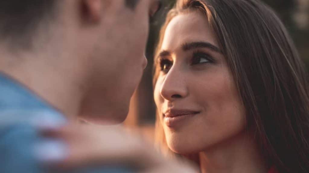 A woman looking her partner in the eye while speaking openly