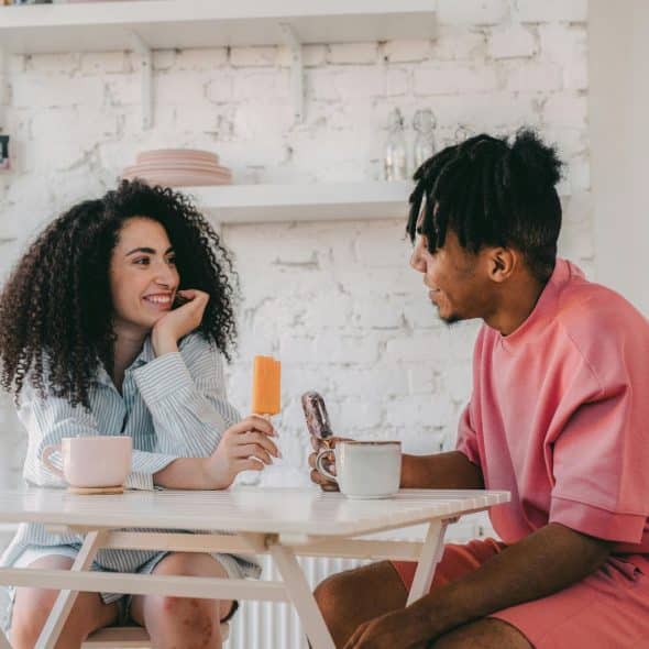 A man and woman looking at each other
