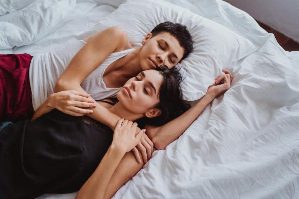A man and woman sleeping together