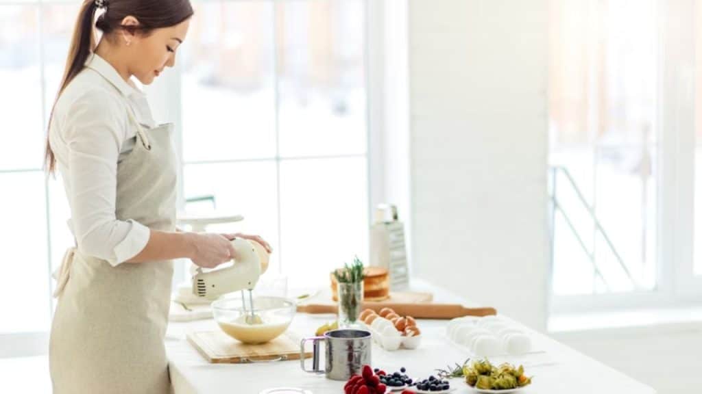 A woman preparing to cook a meal at the table