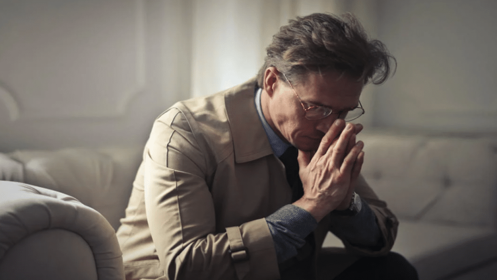 A man looking sad at home