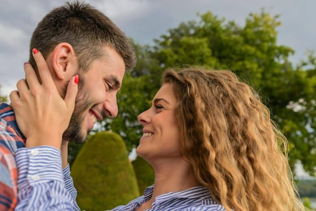 A man and woman facing each other