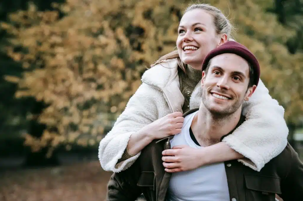A woman hugging a man