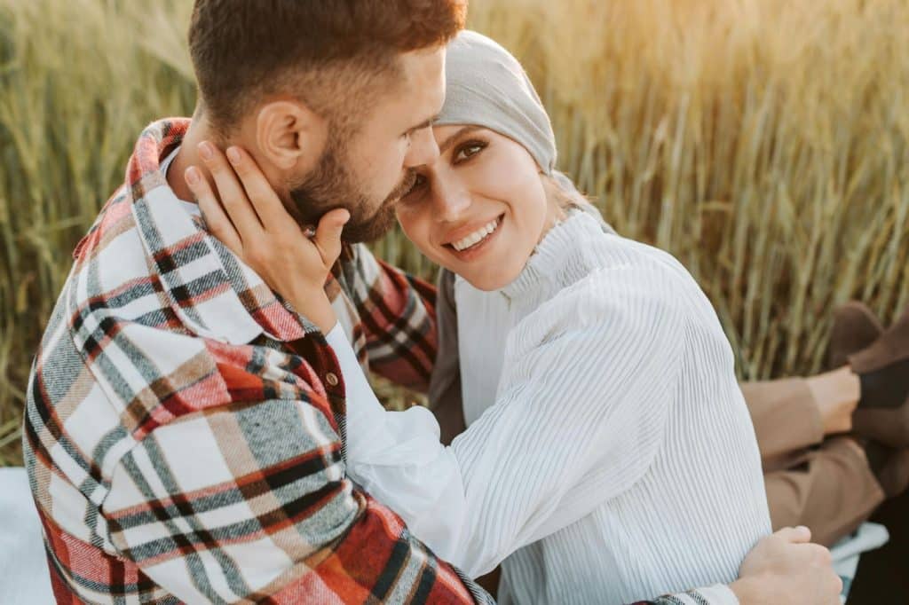 A man hugging a woman