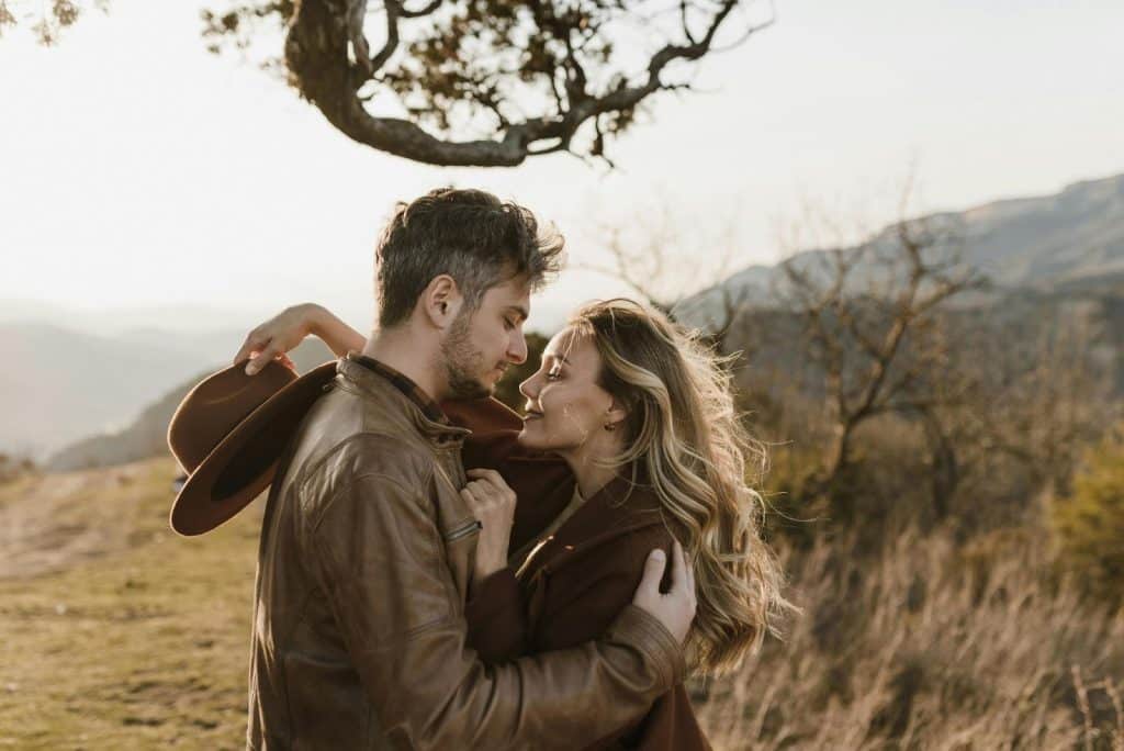 A man and woman facing each other
