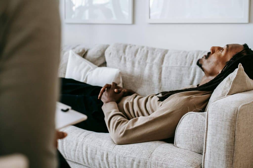 A man laying at the sofa