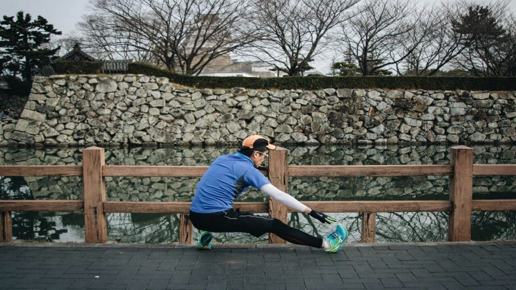 A man stretching before running