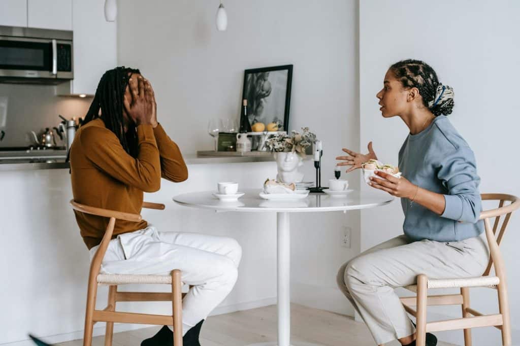 A woman shouting at the man