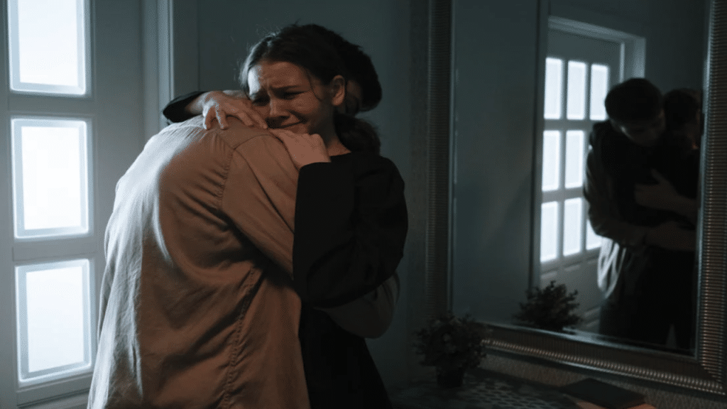 A man consoling his crying wife
