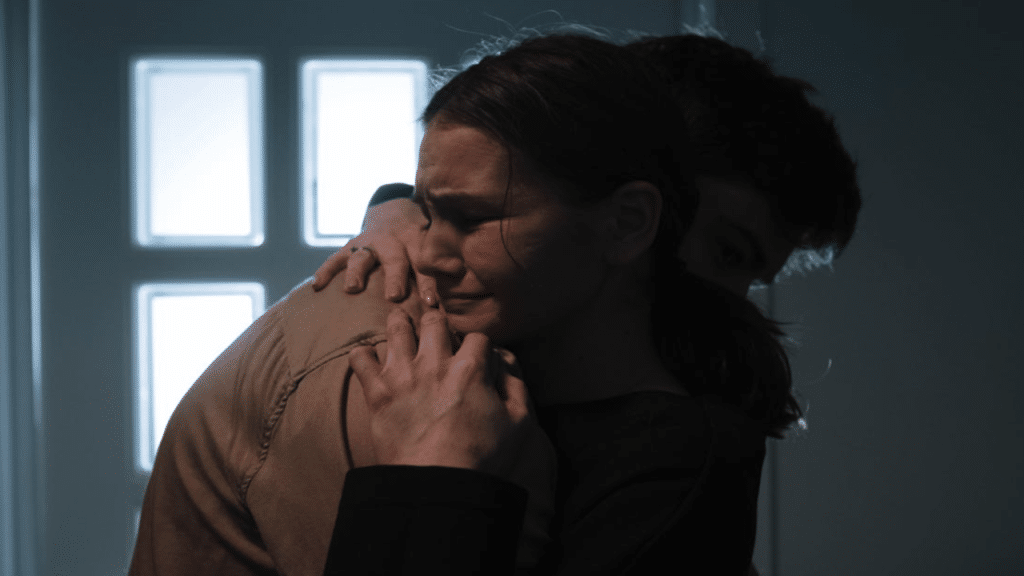 A man consoling his crying wife