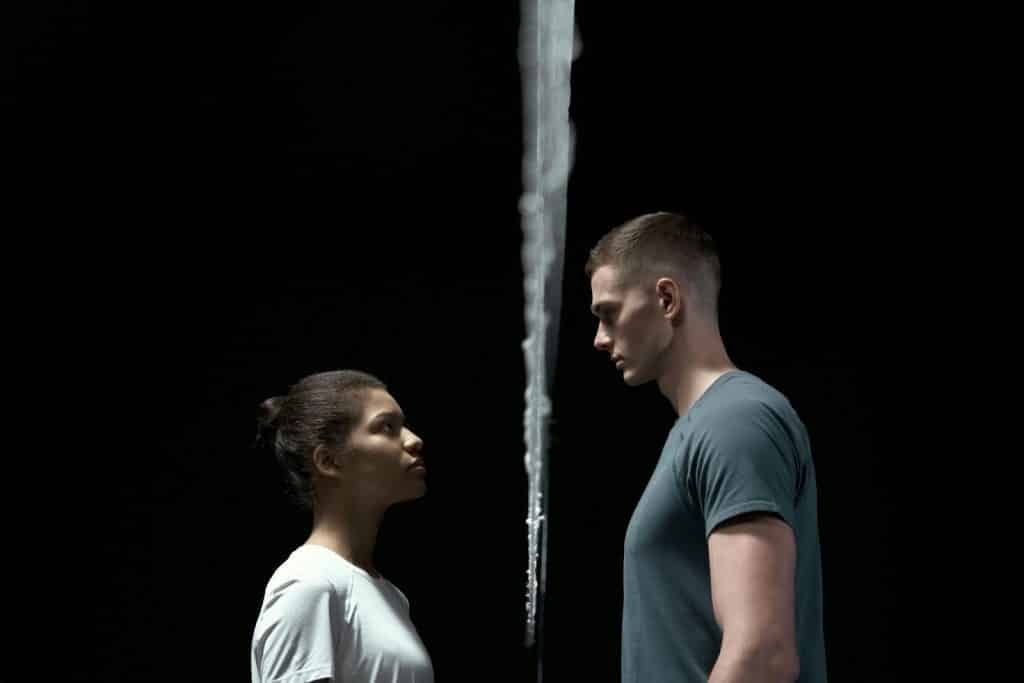 A man and woman facing each other