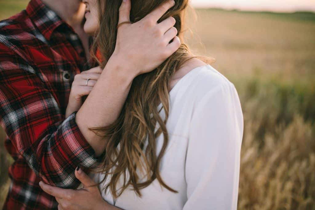 A man and woman hugging each other