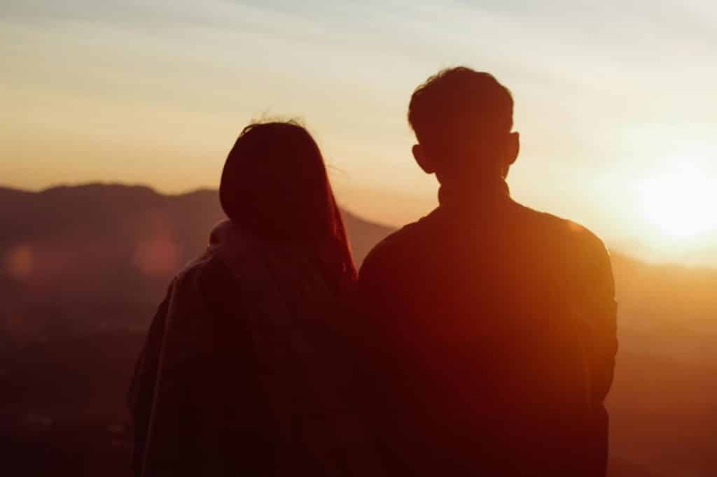 A man and woman during sunset