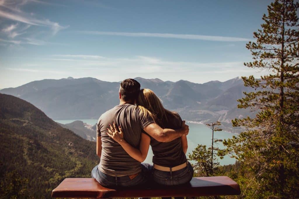 A man and woman leaning on each other