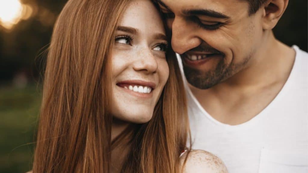 A woman smiling proudly at her partner