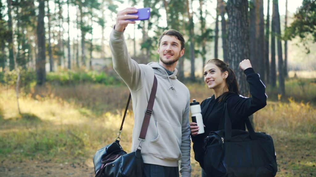 A couple taking a selfie while hiking