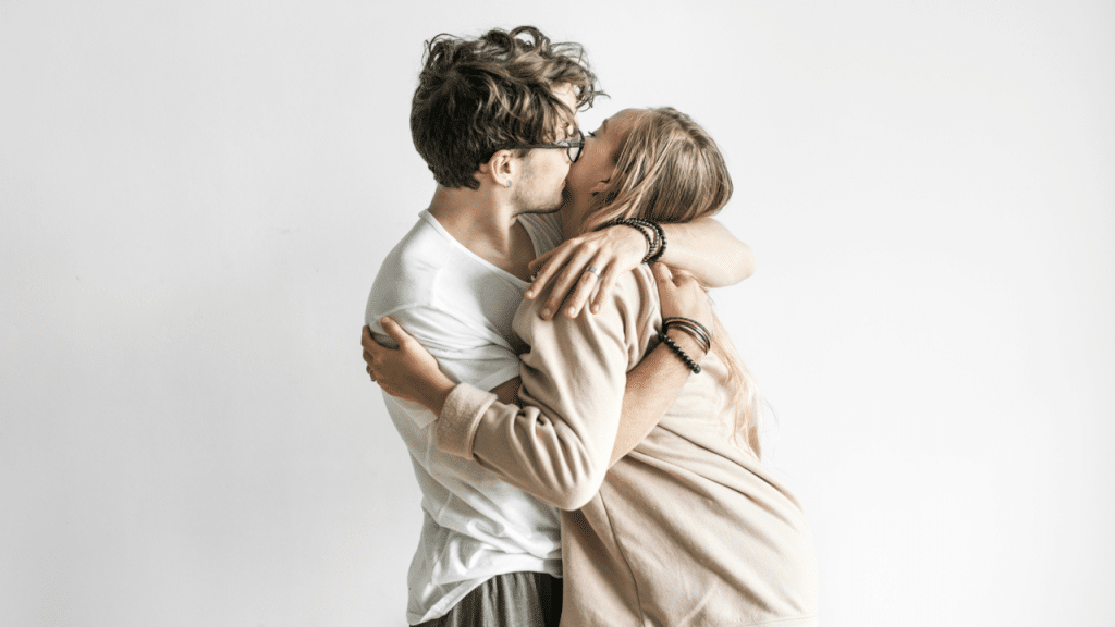 A man kissing his wife’s cheek